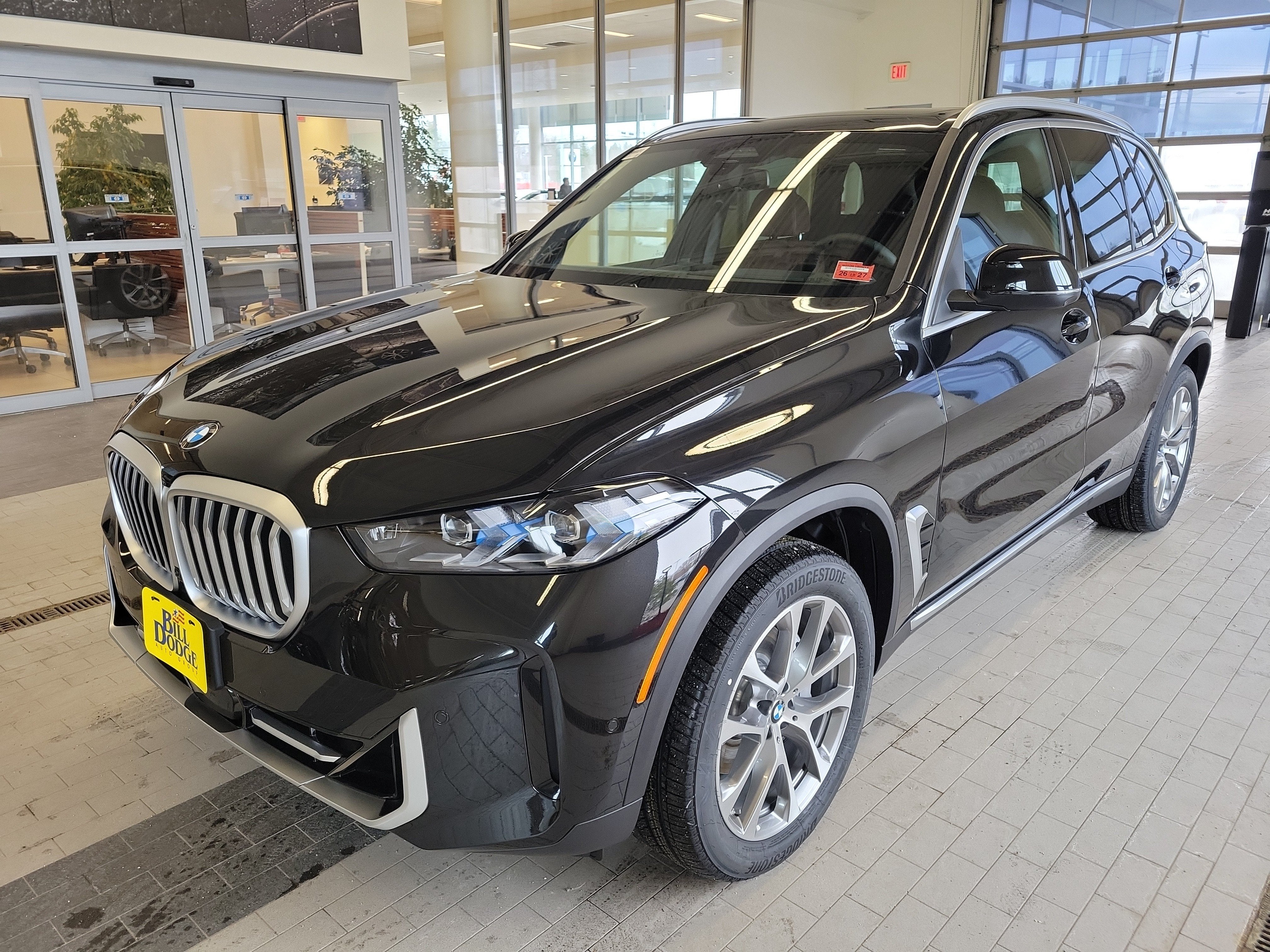 2026 BMW X5 xDrive40i in Black Sapphire Metallic — front three-quarter view