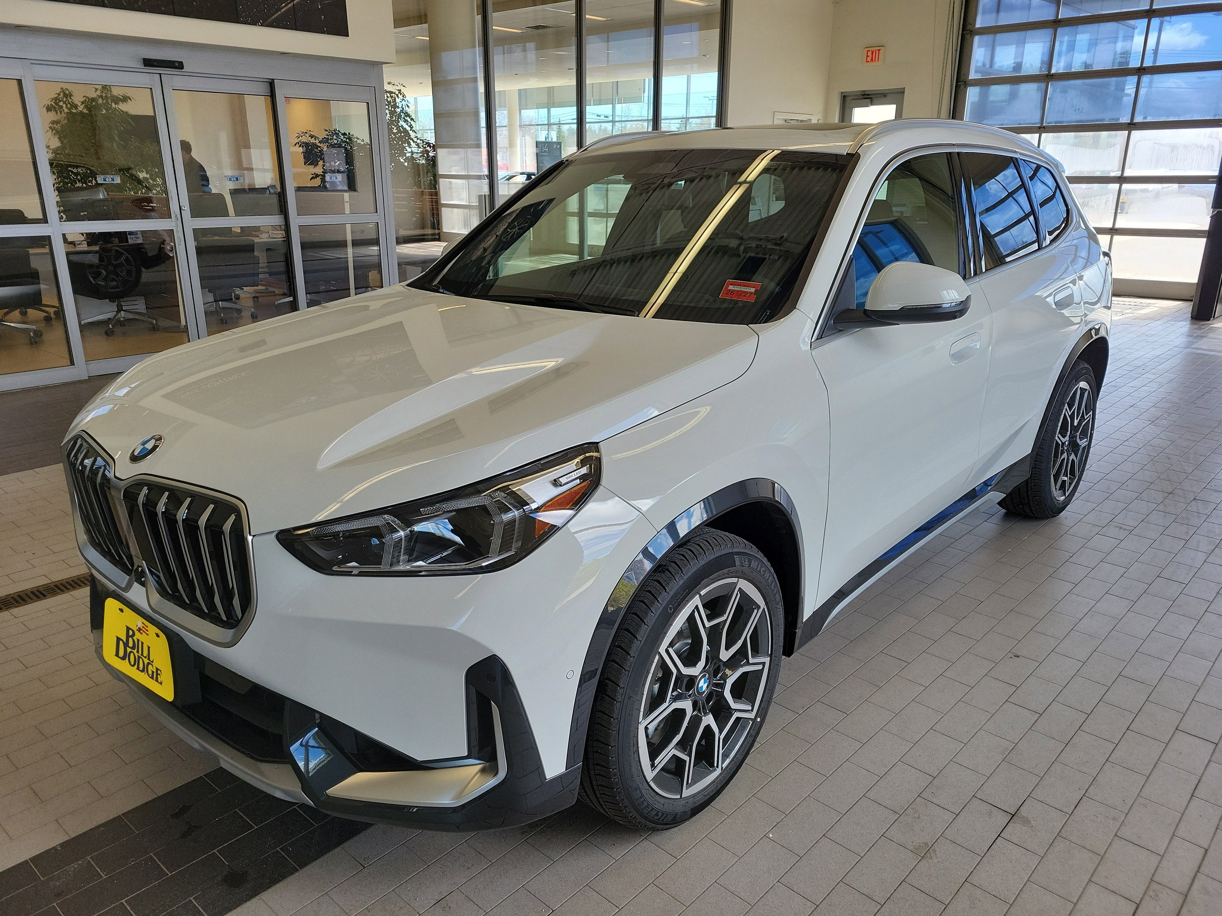 2026 BMW X1 xDrive28i in Alpine White — front three-quarter view